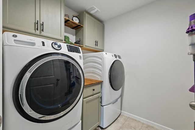 3800 Canyon Verde Ln, Denton, TX 76226 - washroom featuring cabinet space, independent washer and dryer, baseboards, and light tile patterned floors