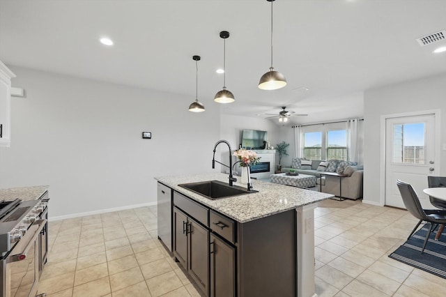 3800 Canyon Verde Ln, Denton, TX 76226 - kitchen featuring a sink, stainless steel appliances, a ceiling fan, light tile patterned flooring, and recessed lighting