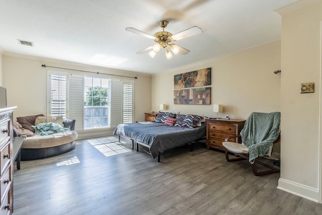 2111 Menton Pl, Carrollton, TX 75006 - bedroom featuring wood finished floors, crown molding, baseboards, and ceiling fan