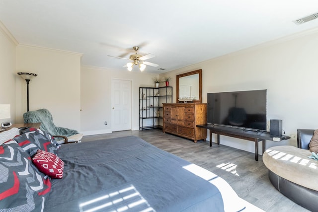 2111 Menton Pl, Carrollton, TX 75006 - bedroom featuring wood finished floors, ornamental molding, baseboards, and a ceiling fan