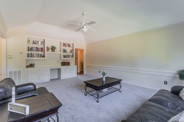 2111 Menton Pl, Carrollton, TX 75006 - living area featuring ceiling fan, vaulted ceiling, light carpet, built in shelves, and crown molding