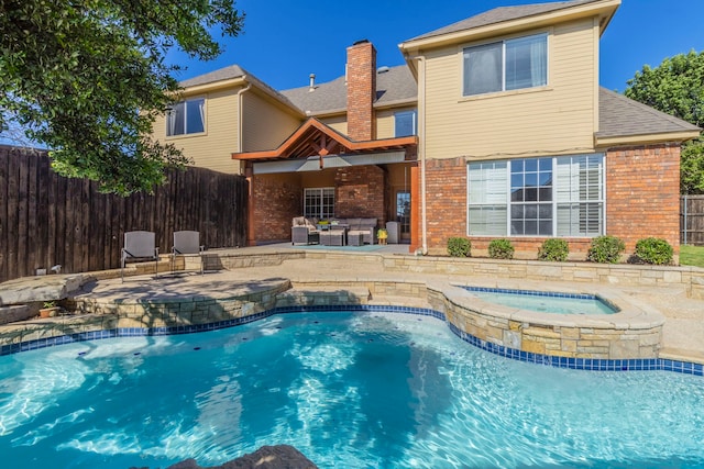 2111 Menton Pl, Carrollton, TX 75006 - view of swimming pool featuring a pool with connected hot tub and a patio