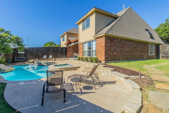 2111 Menton Pl, Carrollton, TX 75006 - view of swimming pool featuring an in-ground hot tub, a fenced backyard, and a patio area