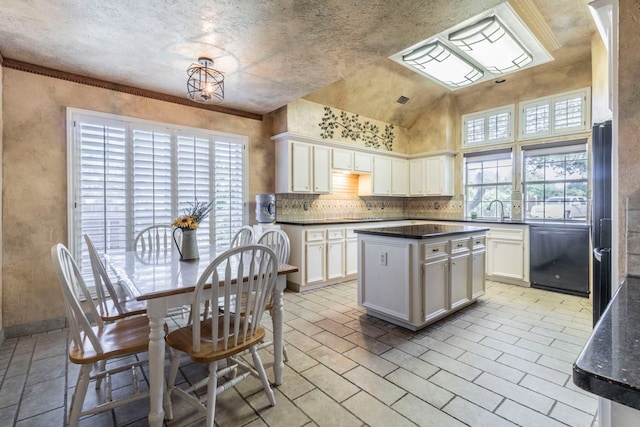 2111 Menton Pl, Carrollton, TX 75006 - kitchen featuring dishwasher, dark countertops, white cabinets, a kitchen island, and high vaulted ceiling