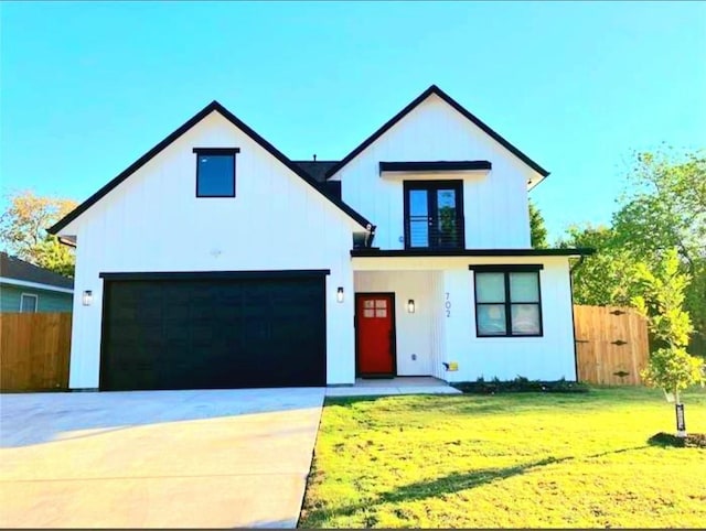 702 Graham Ave, Dallas, TX 75223 - modern farmhouse style home featuring board and batten siding, concrete driveway, and a garage