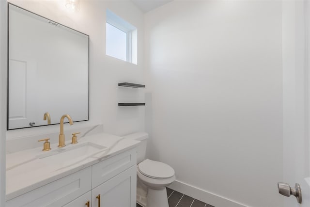 702 Graham Ave, Dallas, TX 75223 - bathroom featuring vanity, toilet, and baseboards