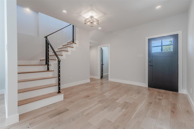 702 Graham Ave, Dallas, TX 75223 - foyer with recessed lighting, stairs, light wood-style flooring, and baseboards