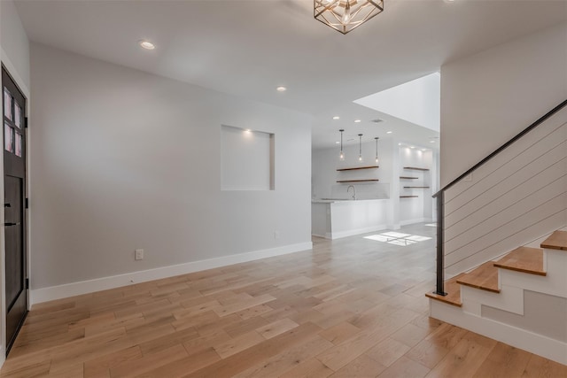 702 Graham Ave, Dallas, TX 75223 - foyer entrance featuring stairway, light wood-type flooring, baseboards, and recessed lighting