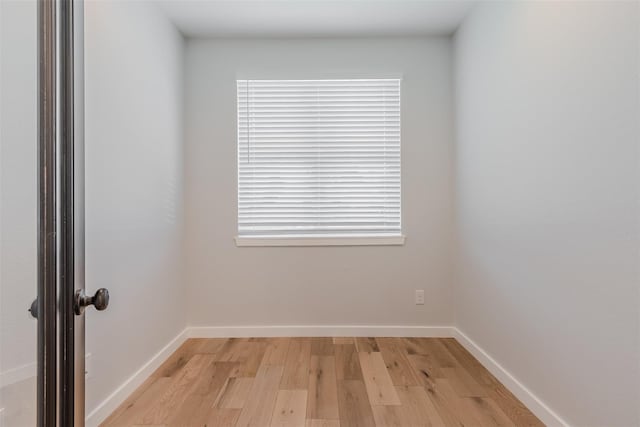 702 Graham Ave, Dallas, TX 75223 - spare room featuring light wood-style flooring and baseboards