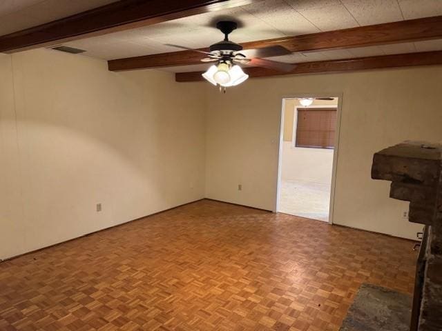 401 Locust St, Shreveport, LA 71105 - empty room featuring beamed ceiling and a ceiling fan