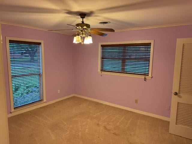 401 Locust St, Shreveport, LA 71105 - carpeted empty room featuring ornamental molding, ceiling fan, and baseboards