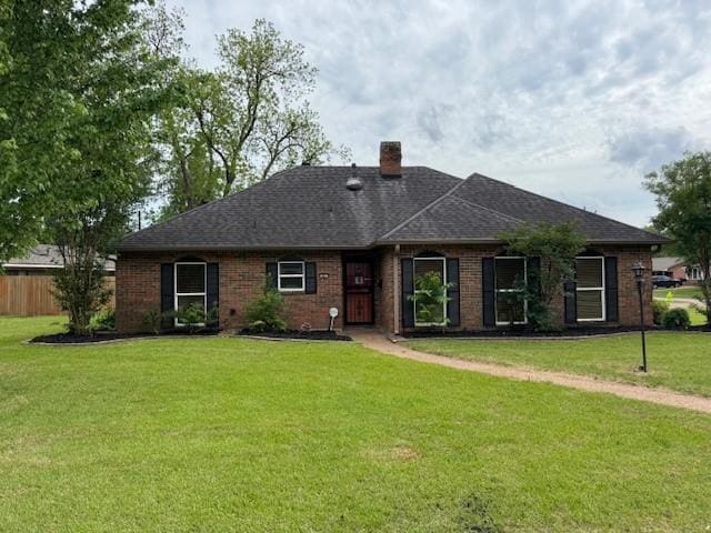 401 Locust St, Shreveport, LA 71105 - rear view of house featuring a chimney, brick siding, and a shingled roof
