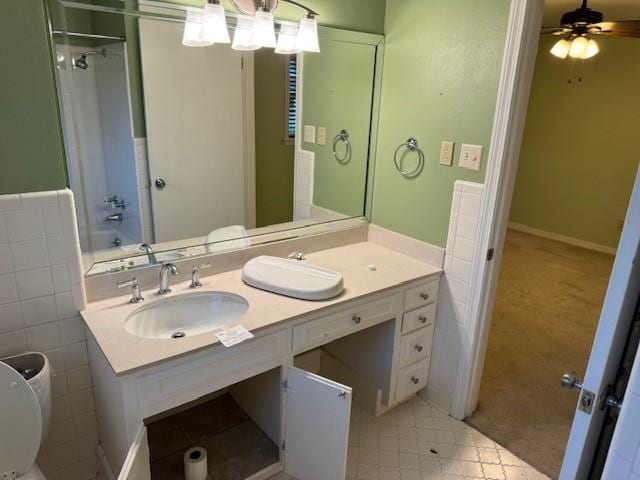401 Locust St, Shreveport, LA 71105 - full bathroom featuring vanity, toilet, ceiling fan, a shower, and tile patterned flooring