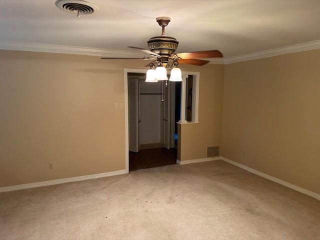 401 Locust St, Shreveport, LA 71105 - unfurnished room featuring ceiling fan, ornamental molding, carpet floors, and baseboards