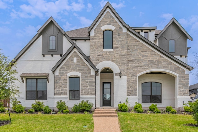 2104 Palafox Dr, Waco, TX 76655 - french country home with stone siding, a front lawn, and a shingled roof