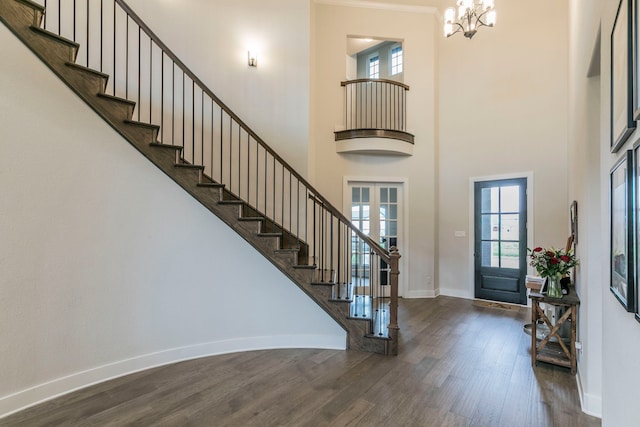 2104 Palafox Dr, Waco, TX 76655 - foyer featuring a chandelier, wood finished floors, stairway, baseboards, and a towering ceiling