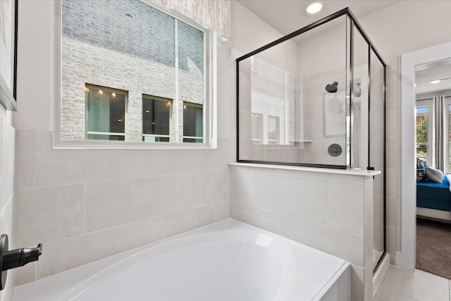 1213 Angel Ln, Aubrey, TX 76227 - ensuite bathroom featuring a bath, a stall shower, and recessed lighting