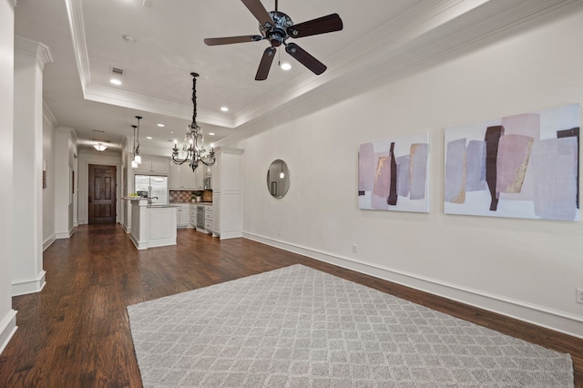 33 Main St Unit 220, Colleyville, TX 76034 - unfurnished living room featuring crown molding, ceiling fan, a chandelier, dark wood-style floors, and recessed lighting