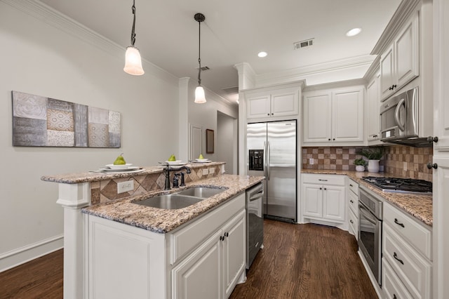 33 Main St Unit 220, Colleyville, TX 76034 - kitchen featuring stainless steel appliances, a sink, ornamental molding, an island with sink, and tasteful backsplash