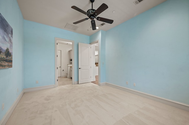 33 Main St Unit 220, Colleyville, TX 76034 - unfurnished bedroom featuring light carpet, baseboards, connected bathroom, and ceiling fan