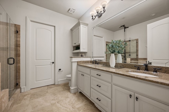 33 Main St Unit 220, Colleyville, TX 76034 - bathroom with a shower stall, double vanity, and toilet