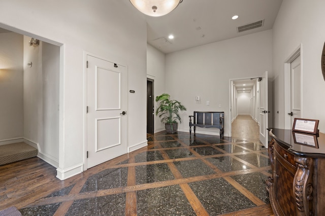 33 Main St Unit 220, Colleyville, TX 76034 - foyer entrance with a towering ceiling, inlaid floor details, baseboards, and recessed lighting
