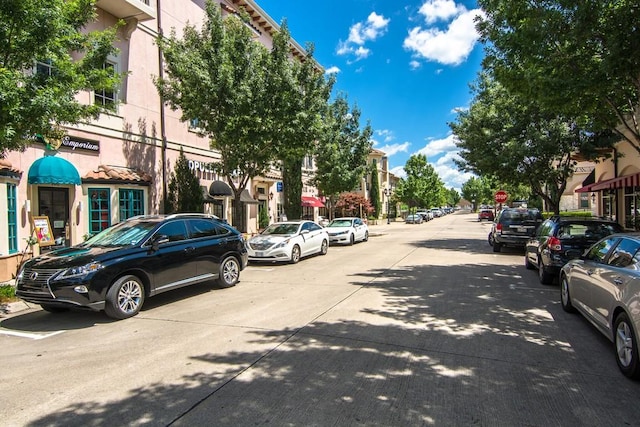 33 Main St Unit 220, Colleyville, TX 76034 - view of concrete road with traffic signs