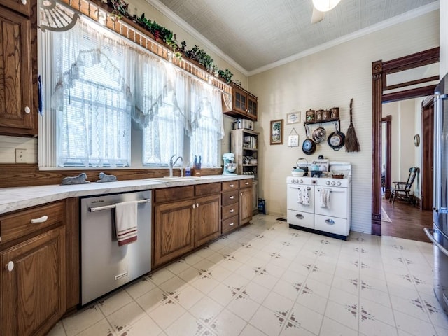 306 E Tarrant St, Bowie, TX 76230 - kitchen featuring dishwasher, a sink, plenty of natural light, light countertops, and an ornate ceiling