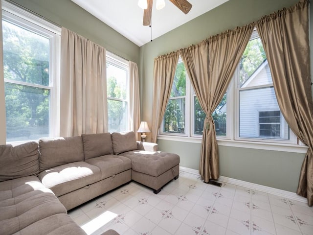 306 E Tarrant St, Bowie, TX 76230 - living area featuring ceiling fan, lofted ceiling, and baseboards
