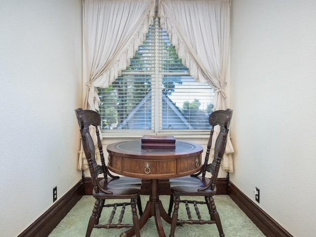 306 E Tarrant St, Bowie, TX 76230 - dining space with baseboards, plenty of natural light, and wood finished floors