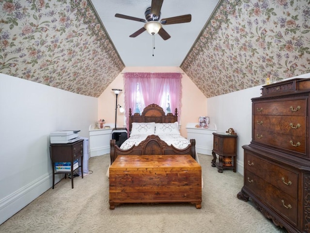 306 E Tarrant St, Bowie, TX 76230 - carpeted bedroom with lofted ceiling, a ceiling fan, and baseboards