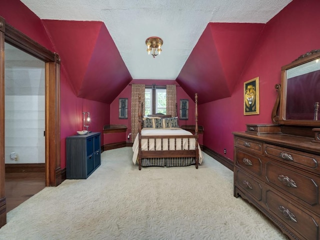 306 E Tarrant St, Bowie, TX 76230 - bedroom with baseboards, lofted ceiling, and light colored carpet