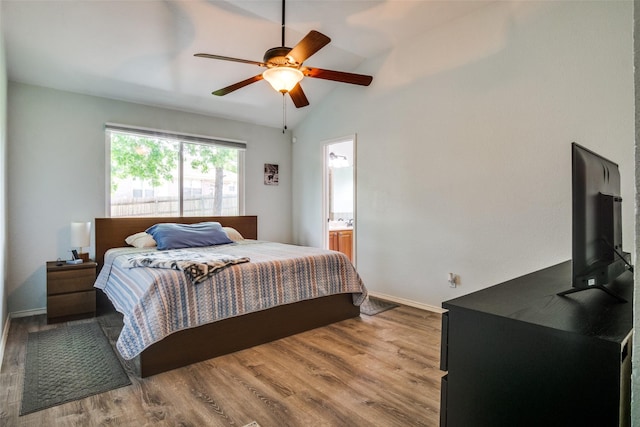 226 Merlin Dr, Weatherford, TX 76086 - bedroom featuring wood finished floors, vaulted ceiling, baseboards, ceiling fan, and ensuite bath