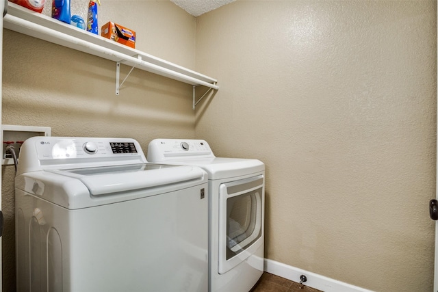 226 Merlin Dr, Weatherford, TX 76086 - laundry room featuring washing machine and clothes dryer and baseboards
