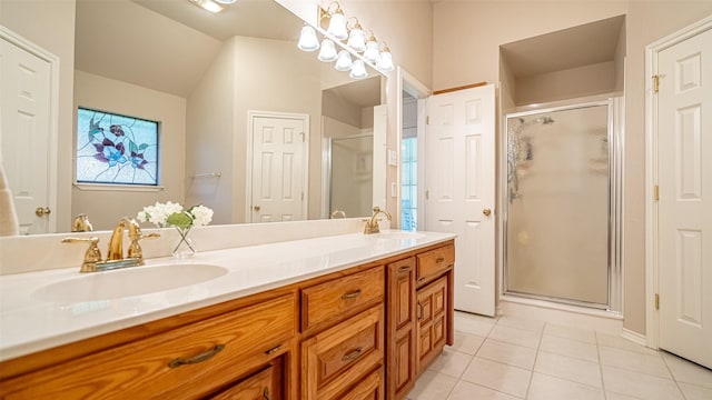 137 Sunny Meadows Dr, Burleson, TX 76028 - bathroom with tile patterned flooring, double vanity, a shower stall, and lofted ceiling