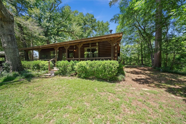 225 Springwood Cir, Chandler, TX 75758 - view of green lawn featuring covered porch