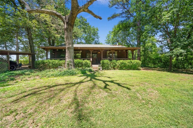 225 Springwood Cir, Chandler, TX 75758 - view of green lawn with covered porch