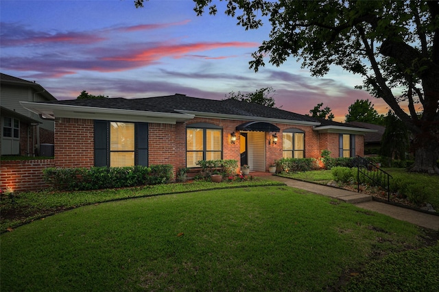 9208 Seagrove Dr, Dallas, TX 75243 - single story home with brick siding and a front lawn
