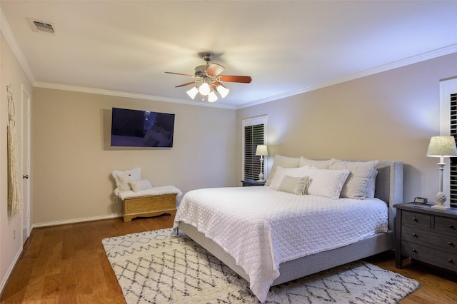 9208 Seagrove Dr, Dallas, TX 75243 - bedroom with wood finished floors, crown molding, baseboards, and a ceiling fan