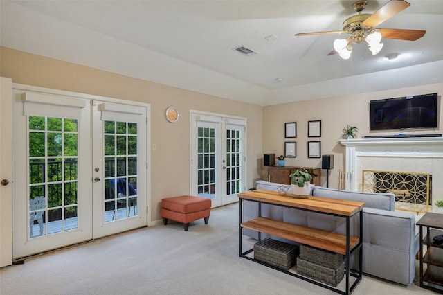 9208 Seagrove Dr, Dallas, TX 75243 - living area featuring french doors, carpet flooring, a tiled fireplace, and ceiling fan