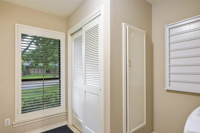 9208 Seagrove Dr, Dallas, TX 75243 - doorway to outside featuring baseboards