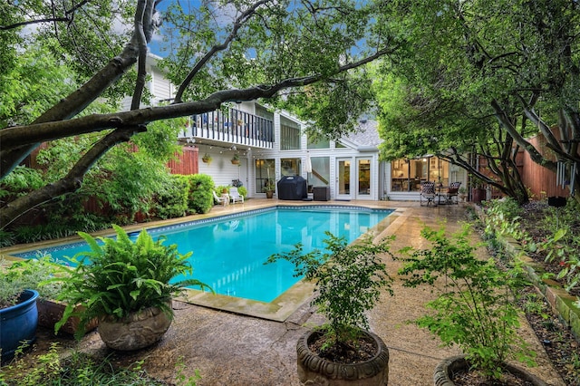 9208 Seagrove Dr, Dallas, TX 75243 - outdoor pool featuring french doors, grilling area, and a patio
