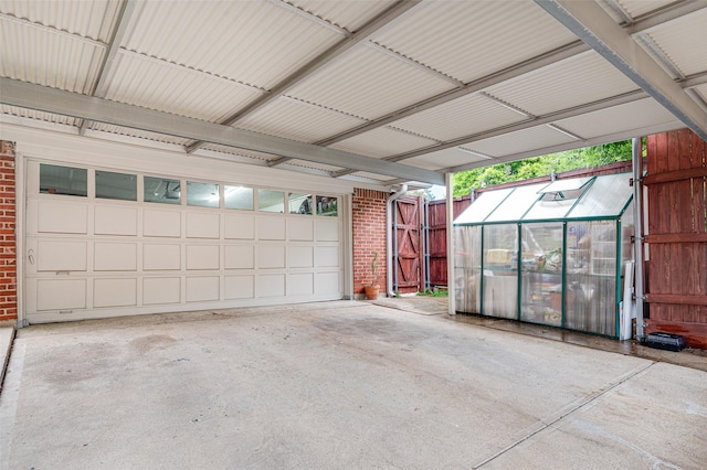 9208 Seagrove Dr, Dallas, TX 75243 - garage with driveway and a carport