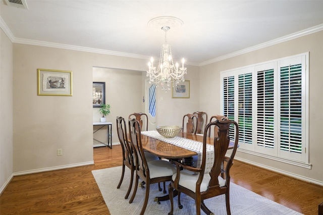 9208 Seagrove Dr, Dallas, TX 75243 - dining room with crown molding, a chandelier, wood finished floors, and baseboards