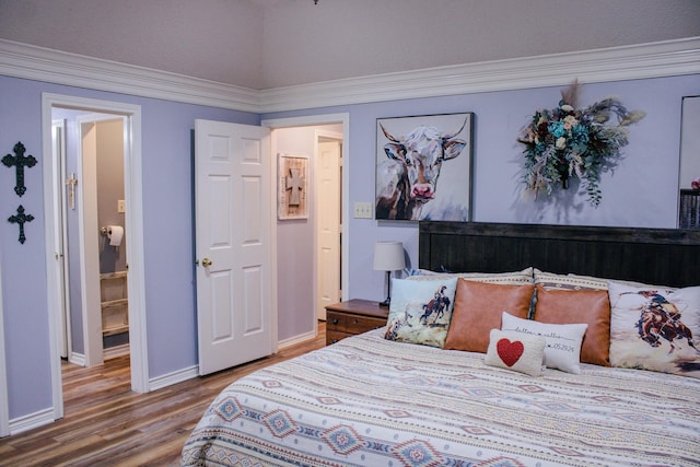 1103 Bluebonnet Hill Dr, Ennis, TX 75119 - bedroom featuring wood finished floors, baseboards, and crown molding