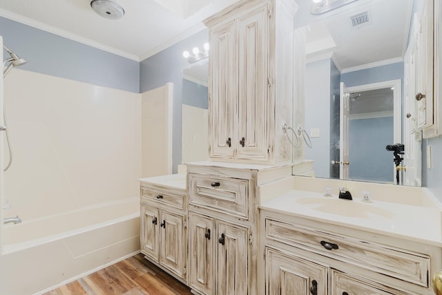 1103 Bluebonnet Hill Dr, Ennis, TX 75119 - bathroom with vanity, bathing tub / shower combination, crown molding, and wood finished floors
