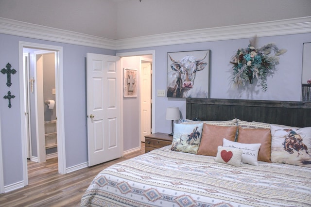 1103 Bluebonnet Hill Dr, Ennis, TX 75119 - bedroom with wood finished floors, ornamental molding, and vaulted ceiling