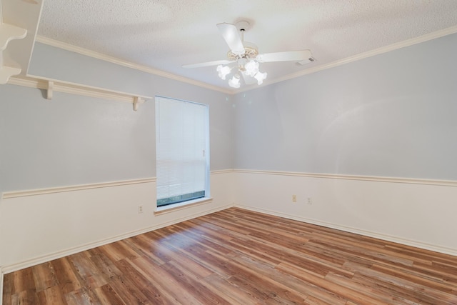 1103 Bluebonnet Hill Dr, Ennis, TX 75119 - unfurnished room with wood finished floors, ceiling fan, a textured ceiling, and crown molding