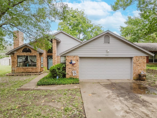 1103 Bluebonnet Hill Dr, Ennis, TX 75119 - view of front of property with brick siding, an attached garage, driveway, and a chimney