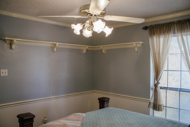 1103 Bluebonnet Hill Dr, Ennis, TX 75119 - bedroom with multiple windows, ornamental molding, a textured ceiling, and a ceiling fan